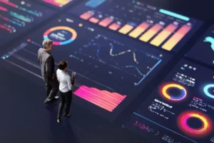 People standing on a dashboard of many graphs and data